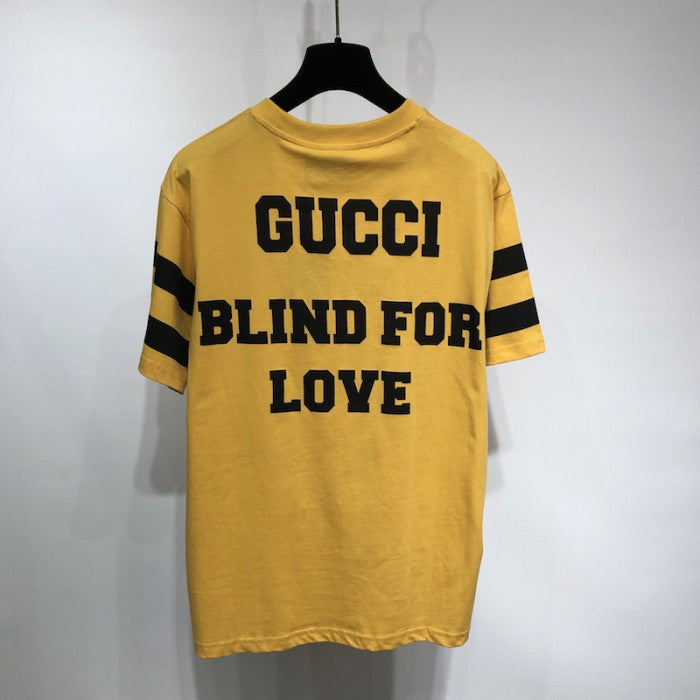 Gucci T-shirt with '25 Gucci Eschatology and Blind for Love 1921' print yellow