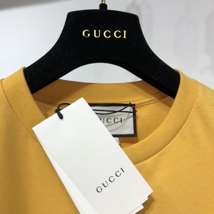 Gucci T-shirt with '25 Gucci Eschatology and Blind for Love 1921' print yellow