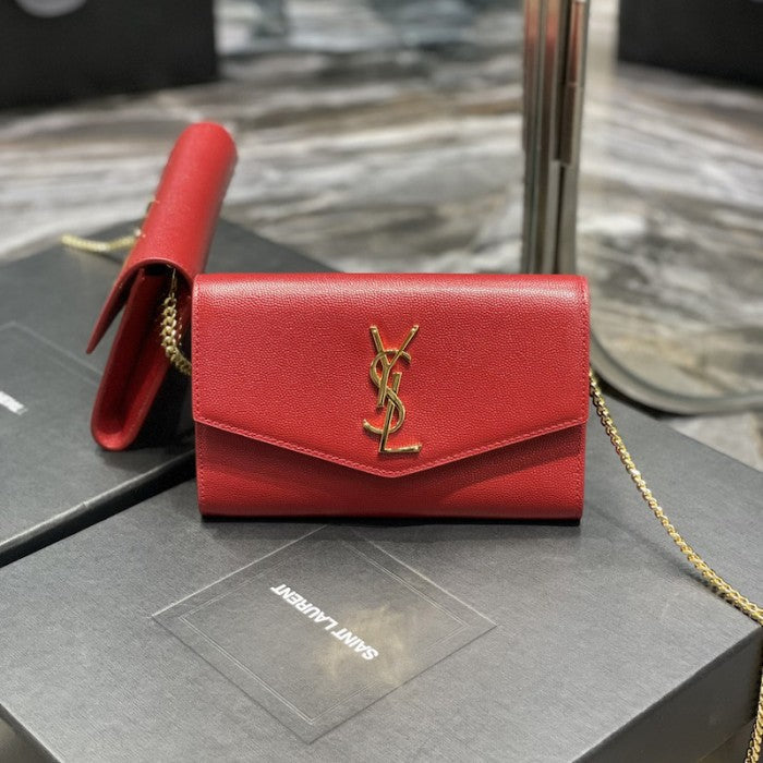 Saint Laurent uptown chain wallet in grain de poudre embossed leather red